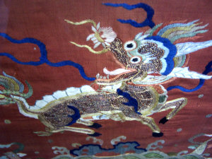 Appraisal: A Chinese embroidered panel the bronze coloured silk ground embroidered