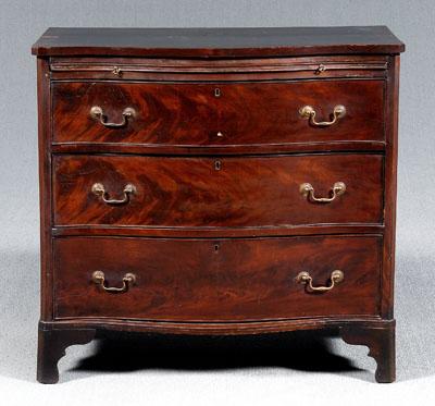 Appraisal: George III mahogany bachelor's chest highly figured mahogany veneers serpentine