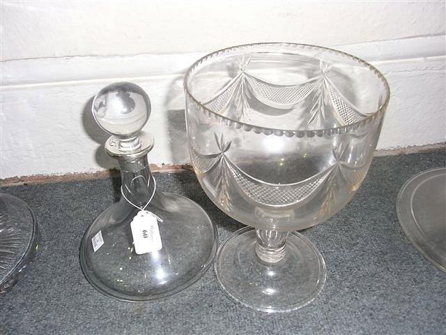 Appraisal: A HEAVY GLASS SHIPS' DECANTER with silver rim and a