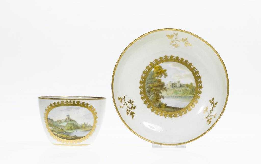 Appraisal: A RARE PINXTON TEACUP AND SAUCER of bute shape with