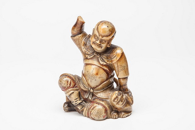 Appraisal: A CHINESE SOAPSTONE CARVED FIGURE of Wu Song a martial