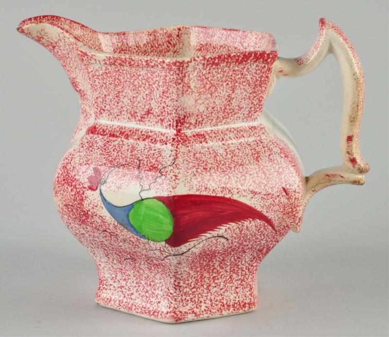 Appraisal: Spatterware Pitcher Description Circa Red paneled with peafowl design on