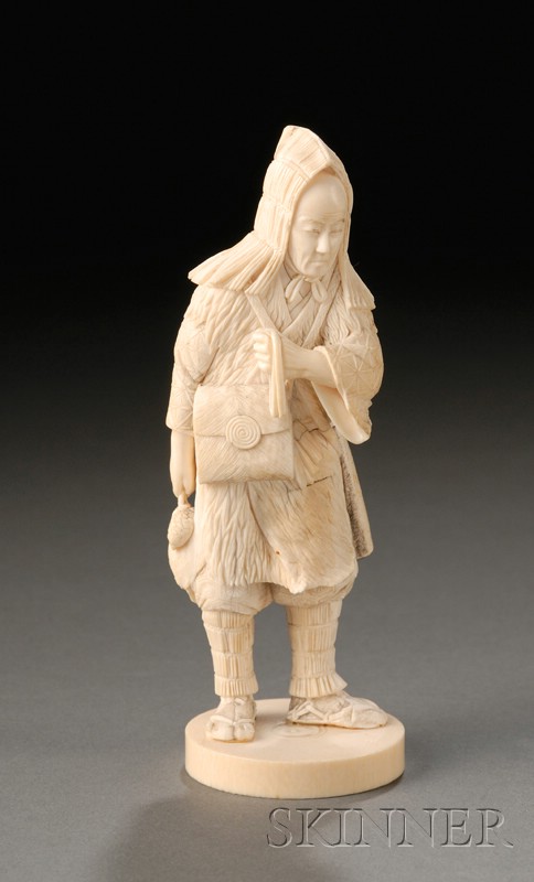 Appraisal: Ivory Carving of a Hunter with a Matchlock Gun Japan