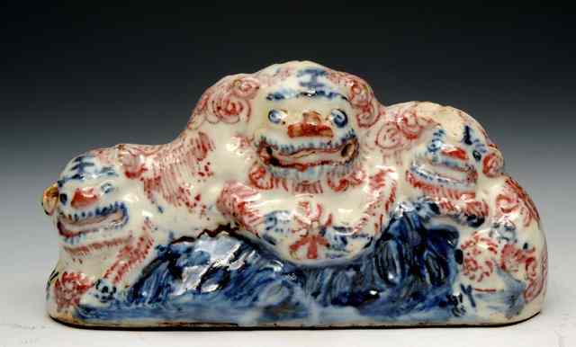 Appraisal: AN ANTIQUE CHINESE POTTERY BRUSH REST in the form of