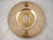 Appraisal: A heavy silver plated dish with gilt metal appliques commemorating