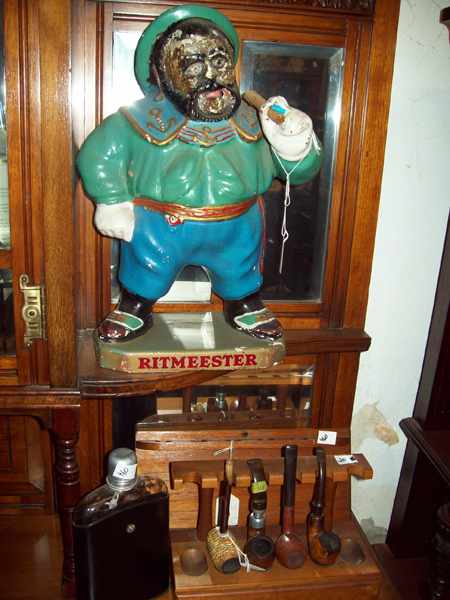 Appraisal: A SAILOR STATUE RITMEESTER WITH TWO PIPE RACKS FOUR PIPES