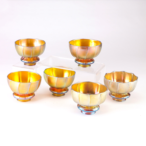 Appraisal: STEUBEN Set of six gold Aurene glass waisted and ribbed