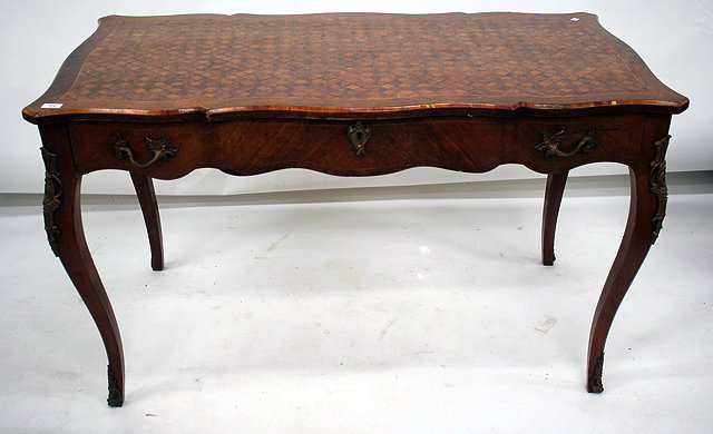 Appraisal: A FRENCH WALNUT SERPENTINE TOPPED RECTANGULAR CENTRE TABLE with parquetry