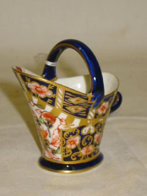 Appraisal: A ROYAL CROWN DERBY PORCELAIN MINIATURE COAL SCUTTLE of tapering