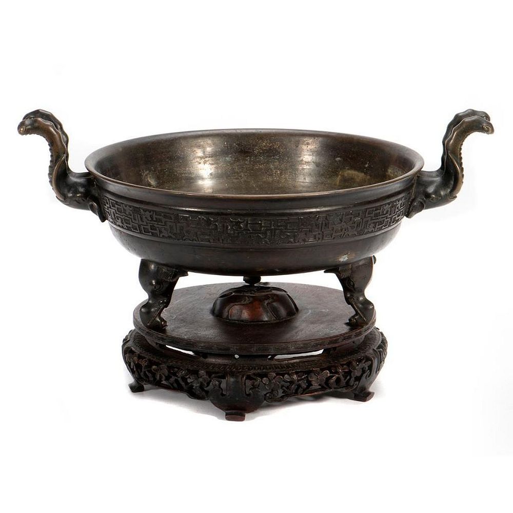 Appraisal: th Century Chinese Bronze Tripod Censer A bronze twin handled