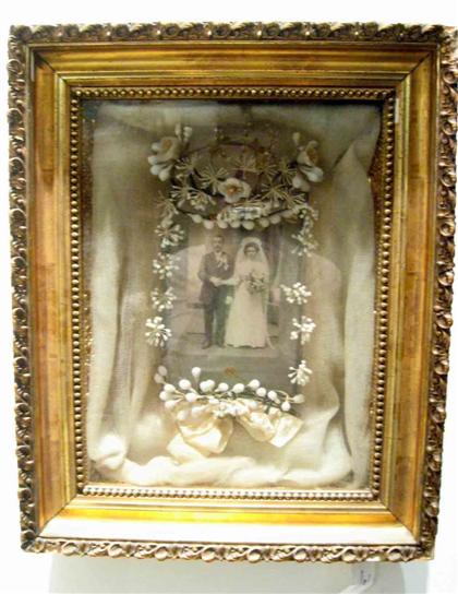 Appraisal: Wedding shadow box th century A white mesh veil encloses