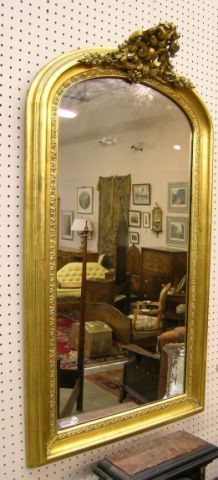 Appraisal: Arch top floral motif gesso and gold leaf wall mirror