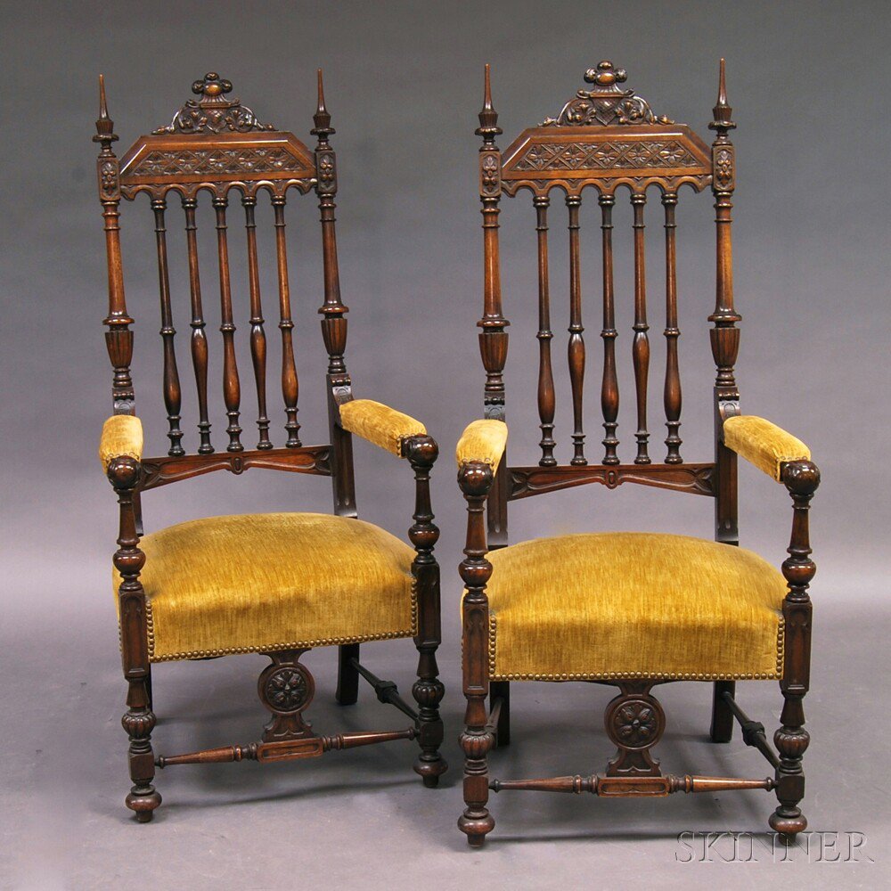 Appraisal: Pair of Gothic-style Carved Walnut Armchairs the shaped cresting with