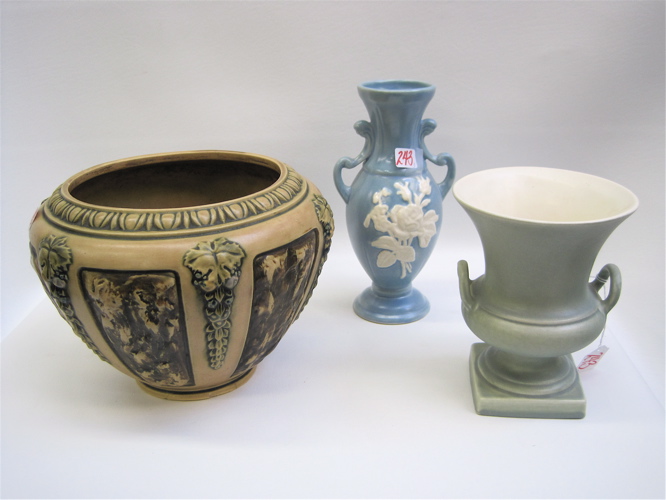 Appraisal: THREE AMERICAN ART POTTERY PIECES Roseville jardiniere in the Florentine