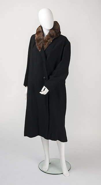 Appraisal: A black coat with fur collar full length sleeves and