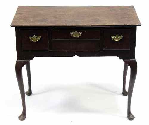 Appraisal: A mahogany three-drawer side table on cabriole legs cm wide