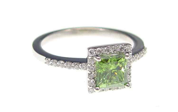 Appraisal: K GREEN DIAMOND RING K white gold ring centers a