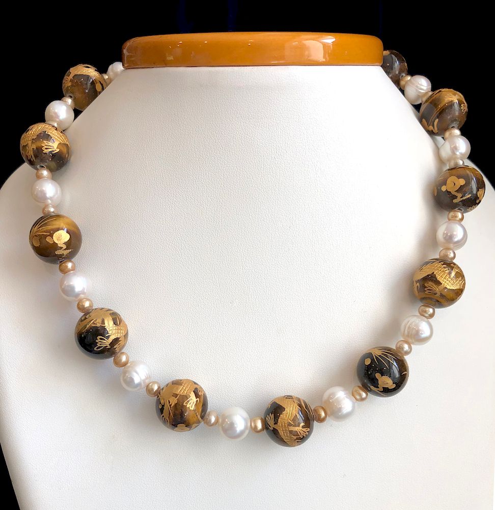 Appraisal: mm Tiger's Eye Bead Engraved with Gold Necklace with White