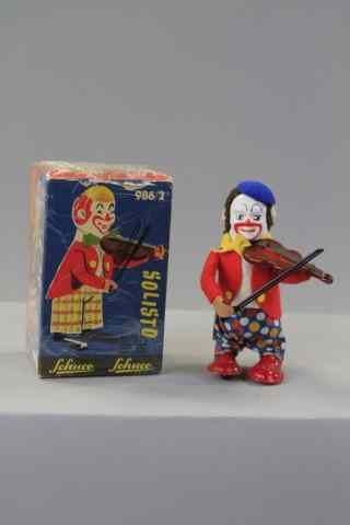 Appraisal: SCHUCO CLOWN VIOLINIST Germany boxed example depicted in jacket colorful