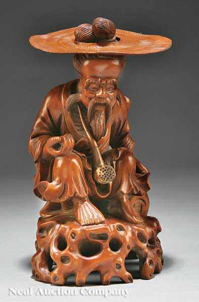 Appraisal: A Chinese Carved Wood Figure of an Old Man with