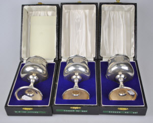 Appraisal: Three cased silver wine goblets with gilt interiors A T