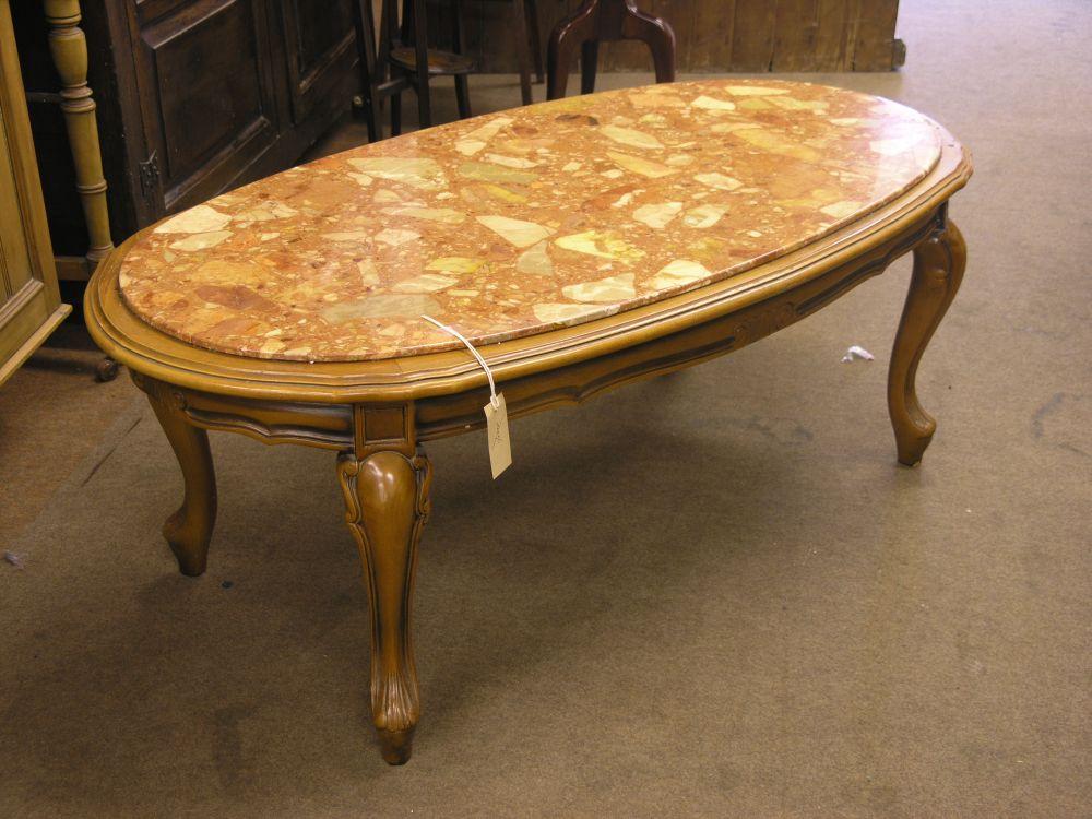 Appraisal: A reproduction oval coffee table with marble top on cabriole