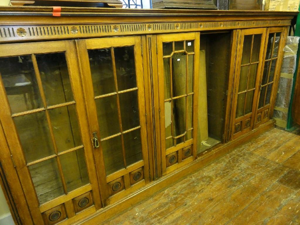 Appraisal: A late Victorian walnut freestanding sectional bookcase enclosed by three