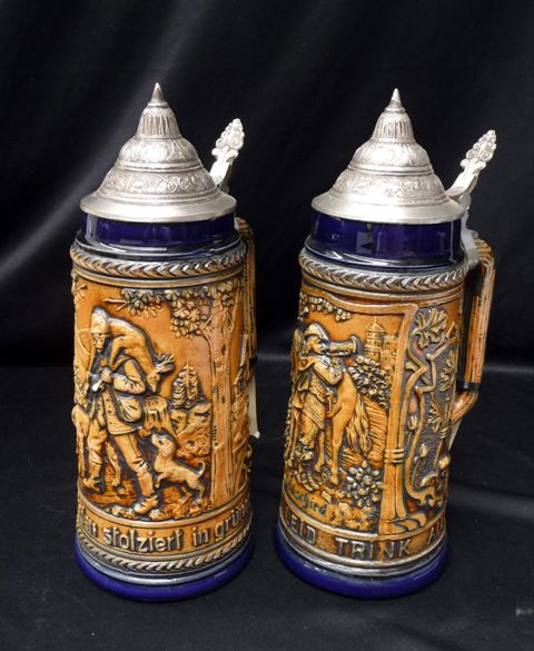 Appraisal: A pair of German beer steins with pewter lids by