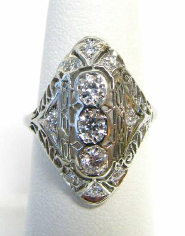 Appraisal: K White Gold Filigree diamond ring with three center diamonds