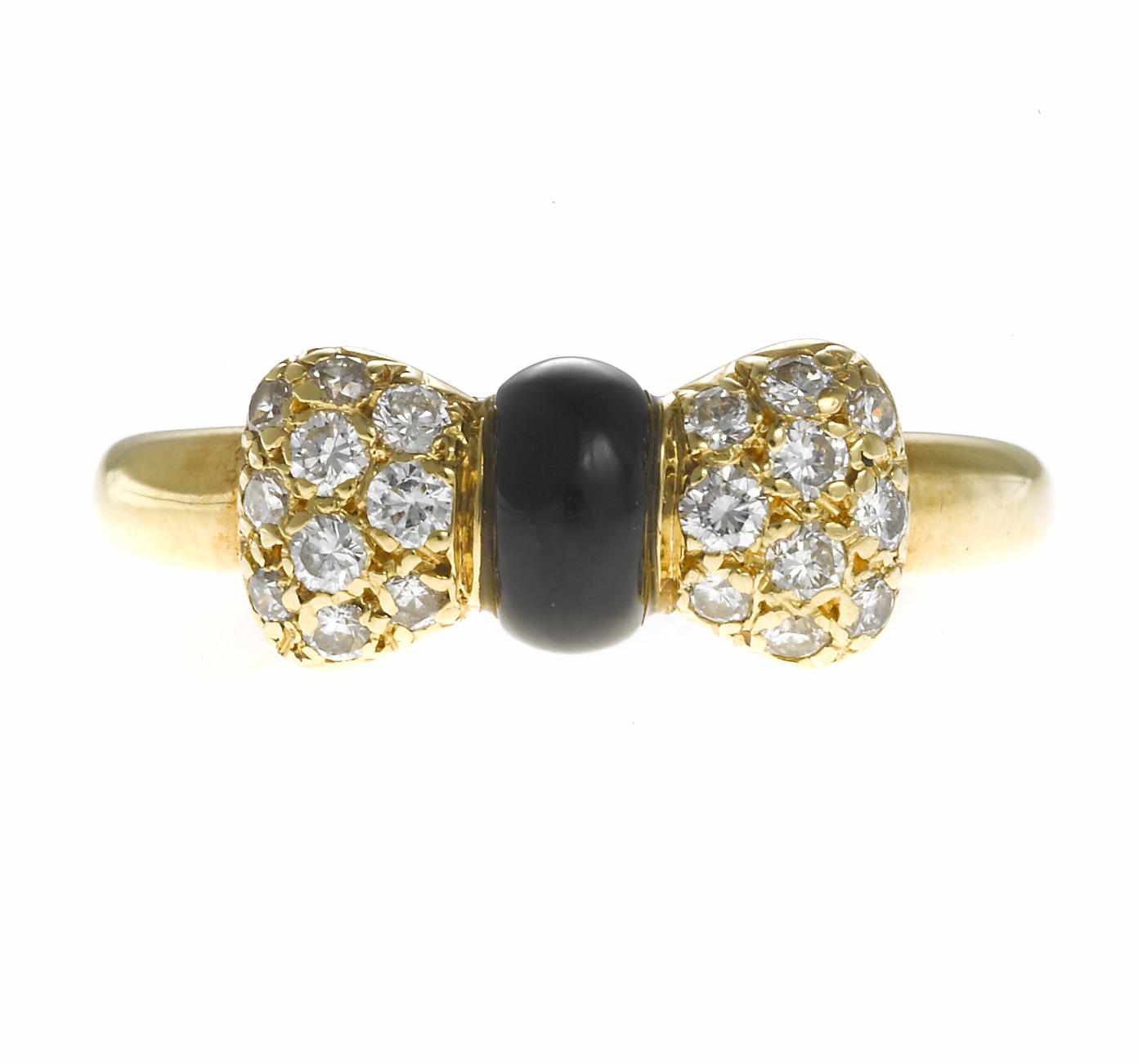 Appraisal: A black onyx and diamond bow ring Van Cleef Arpels