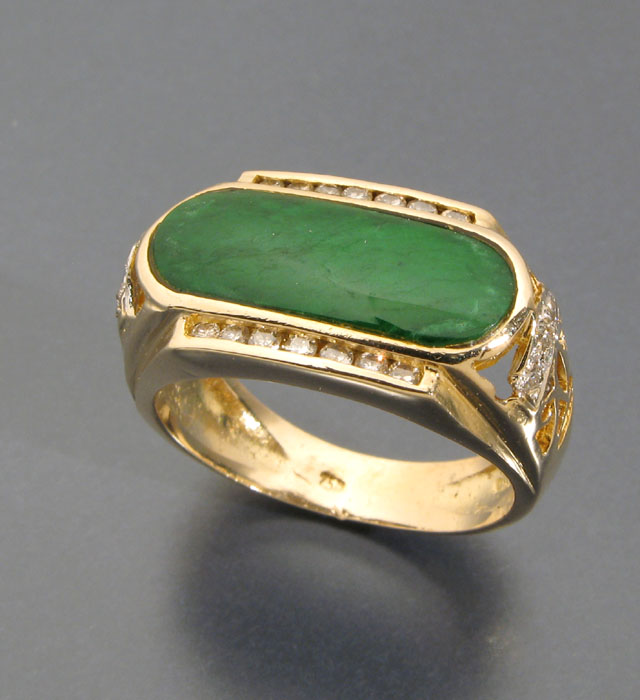 Appraisal: JADE DIAMOND AND EIGHTEEN KARAT GOLD RING centering an oblong