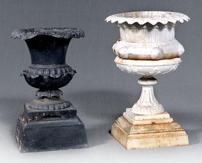 Appraisal: Two cast iron garden urns each urn form on stepped