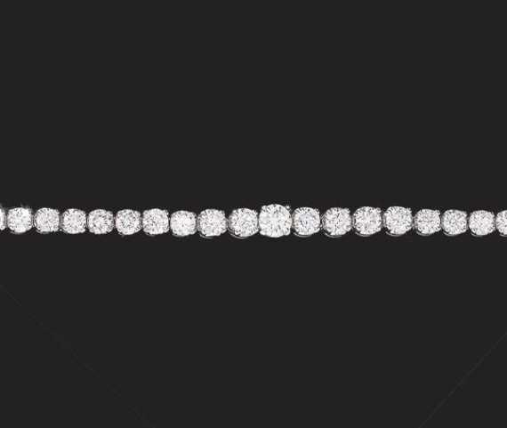 Appraisal: BRILLIANT-CUT DIAMOND-BRACELET White gold Classic tennis bracelet with slightly graduated