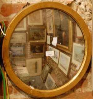 Appraisal: A gilt framed convex wall mirror