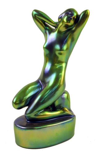 Appraisal: ZSOLNAY ART POTTERY FIGURE a nude female figure seated arms