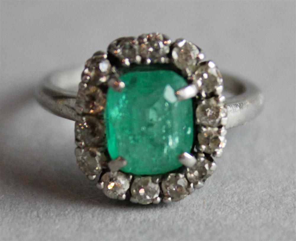 Appraisal: LADY'S EMERALD AND DIAMOND CLUSTER RING rubbed marks inside shank