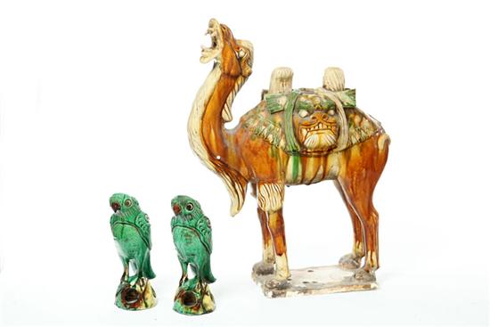 Appraisal: THREE POTTERY FIGURES China th century T'ang style camel with