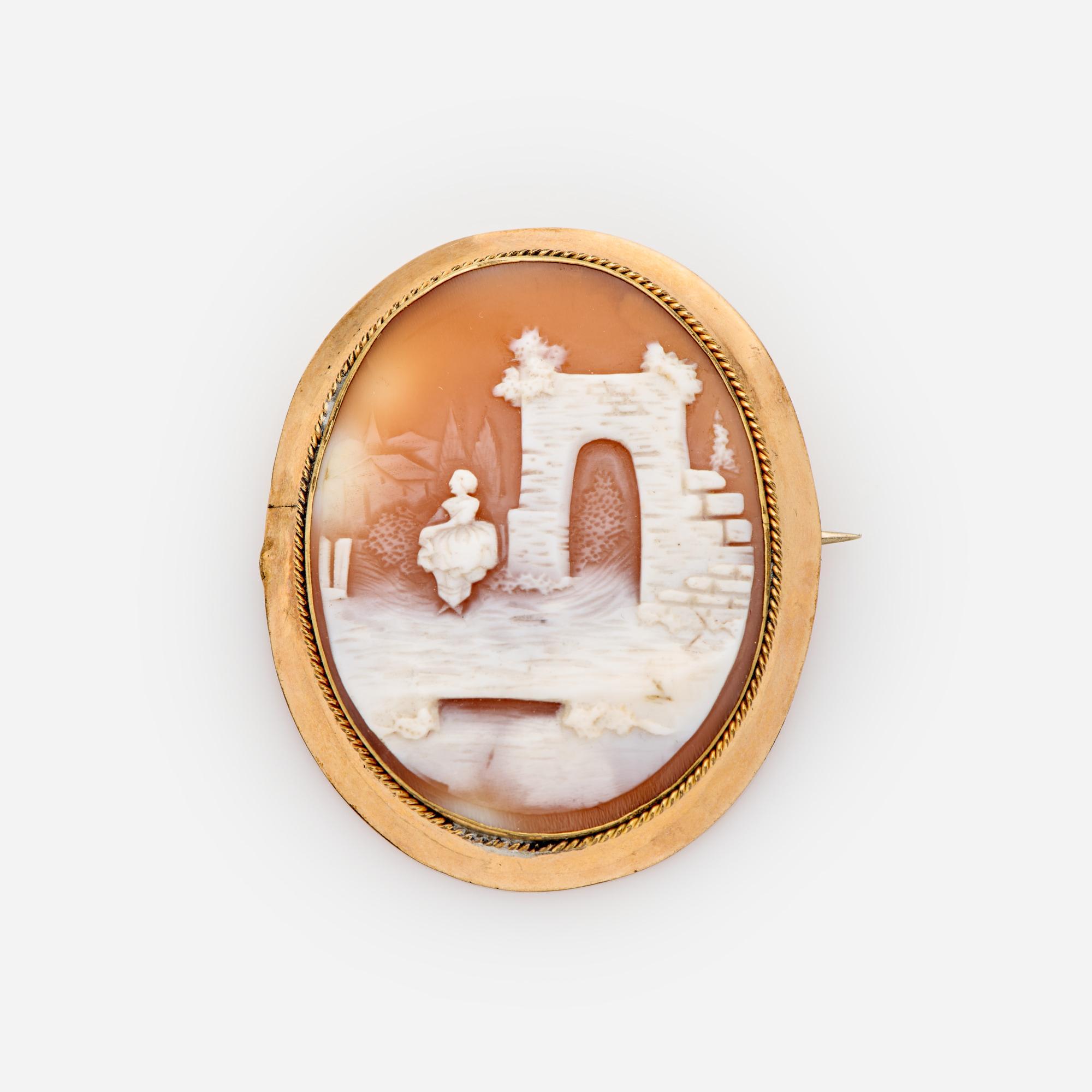 Appraisal: ANTIQUE LARGE SHELL CAMEO BROOCH LADY IN ARCHWAY SCENE An