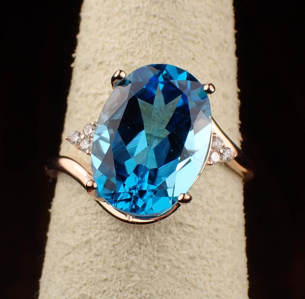 Appraisal: BLUE TOPAZ DIAMOND AND FOURTEEN KARAT ROSE GOLD RING with