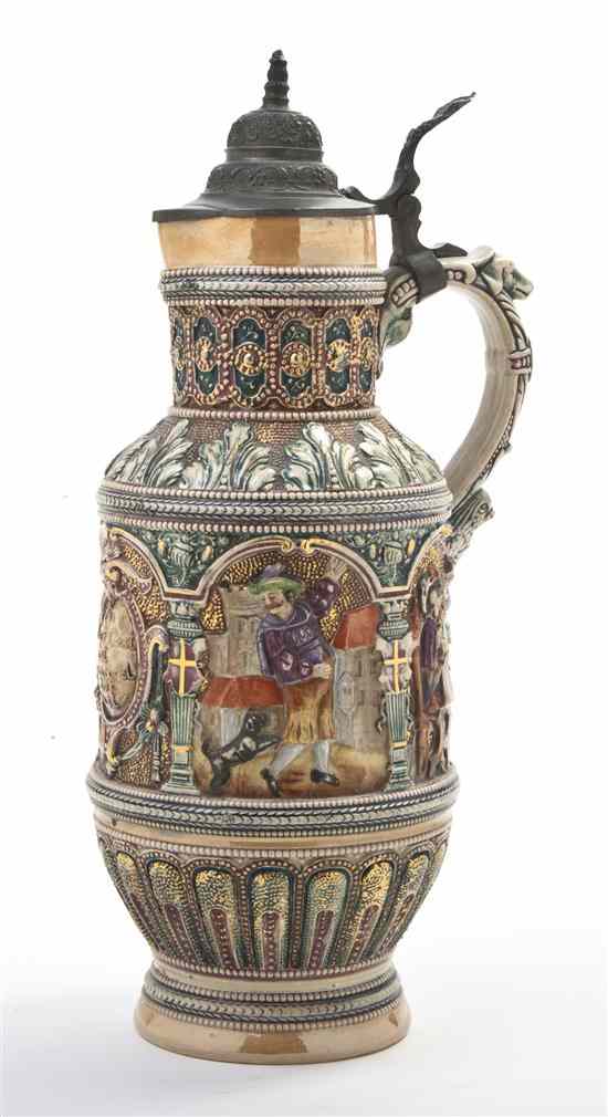 Appraisal: A German Pottery Stein Diesinger with raised decoration of figures