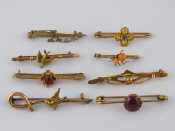 Appraisal: Seven assorted carat gold bar brooches and one silver gilt