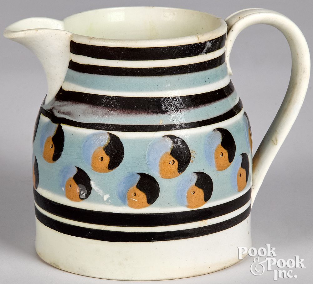 Appraisal: Mocha pitcher with cat's-eye decoration Mocha pitcher with cat's-eye decoration