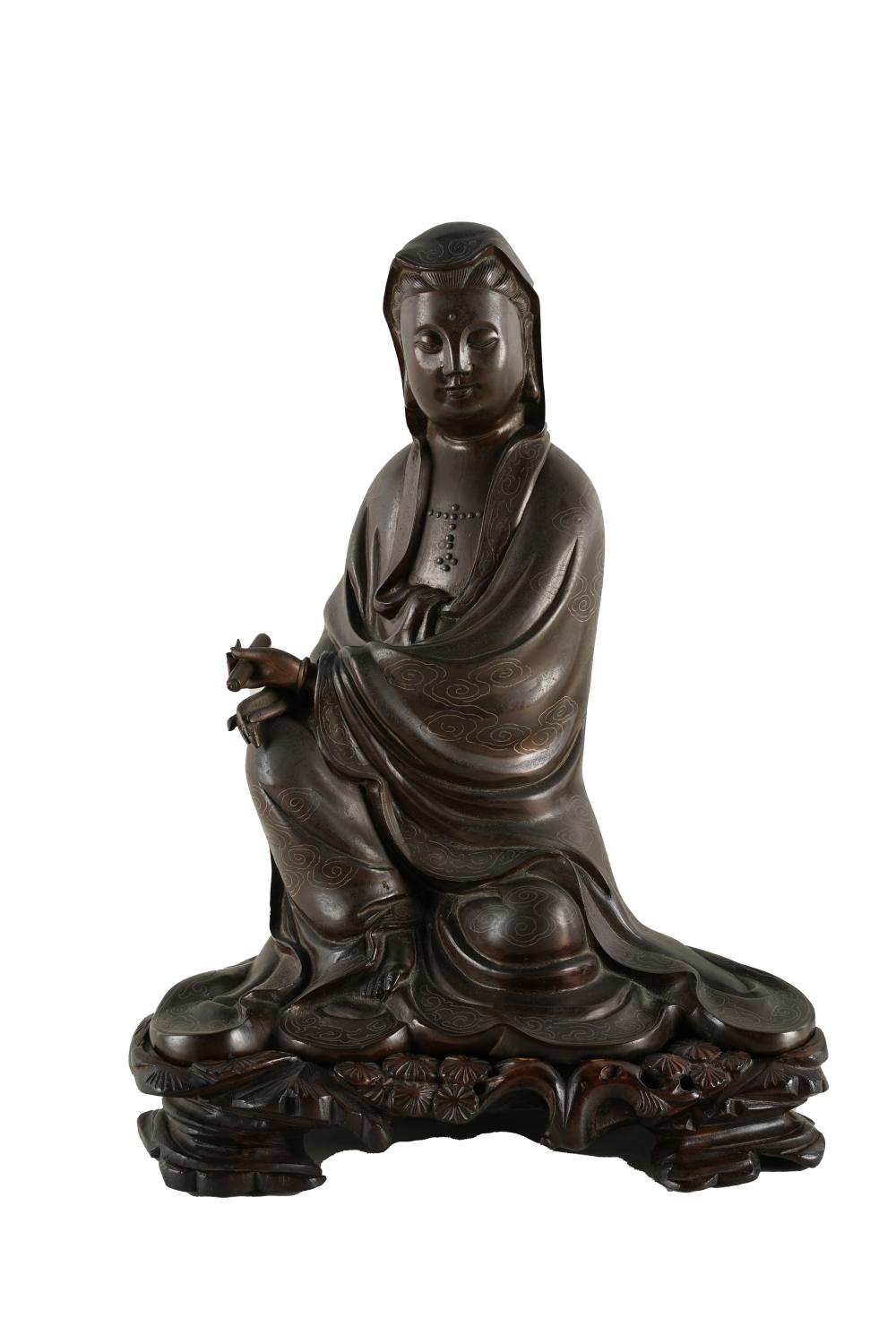 Appraisal: CHINESE SILVER-INLAID BRONZE FIGURE OF GUANYINsigned with carved fitted wood