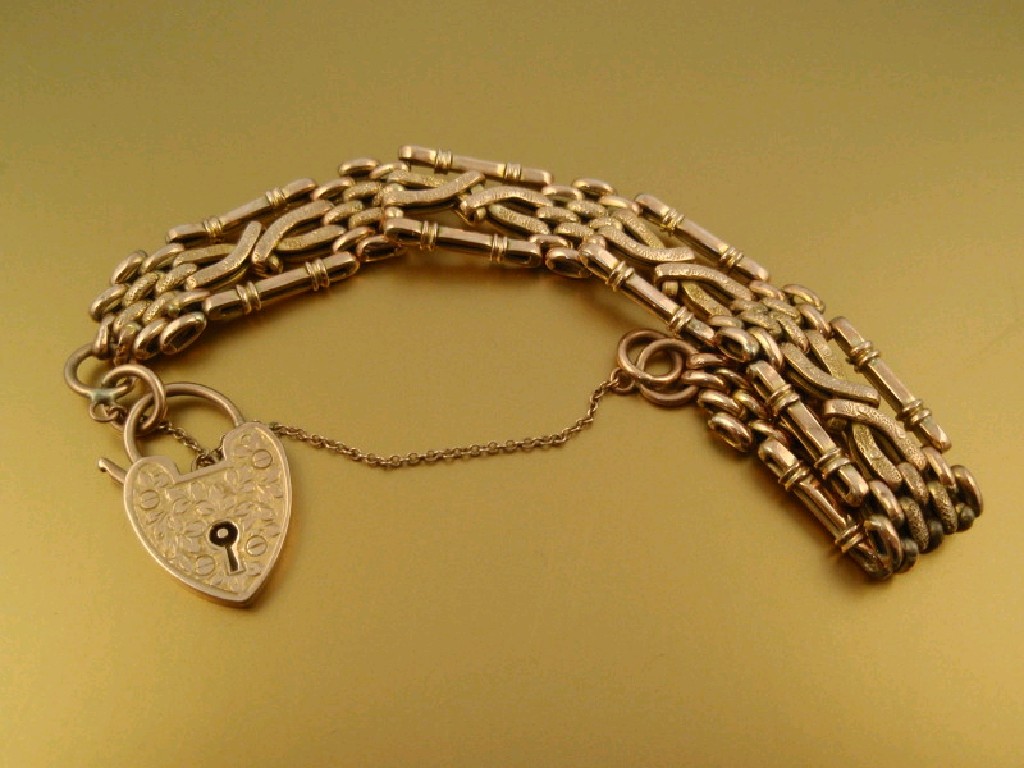 Appraisal: A fancy link gate bracelet stamped ct g