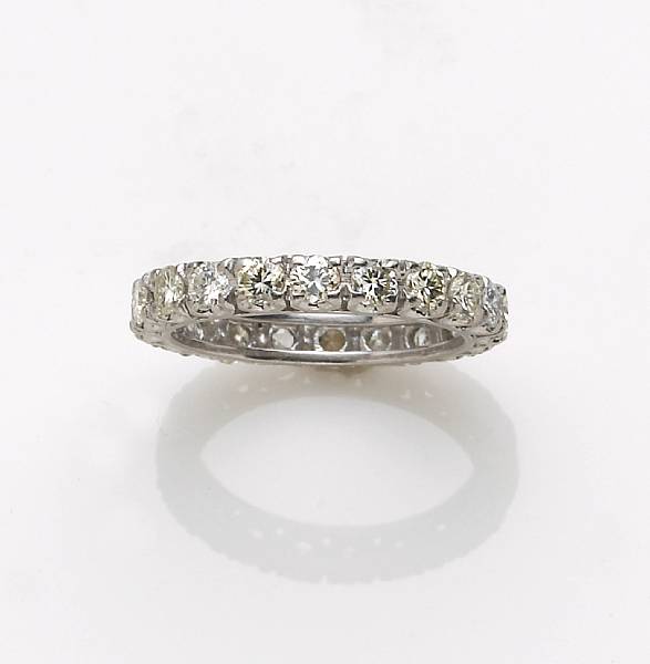 Appraisal: A diamond and platinum eternity band estimated total diamond weight