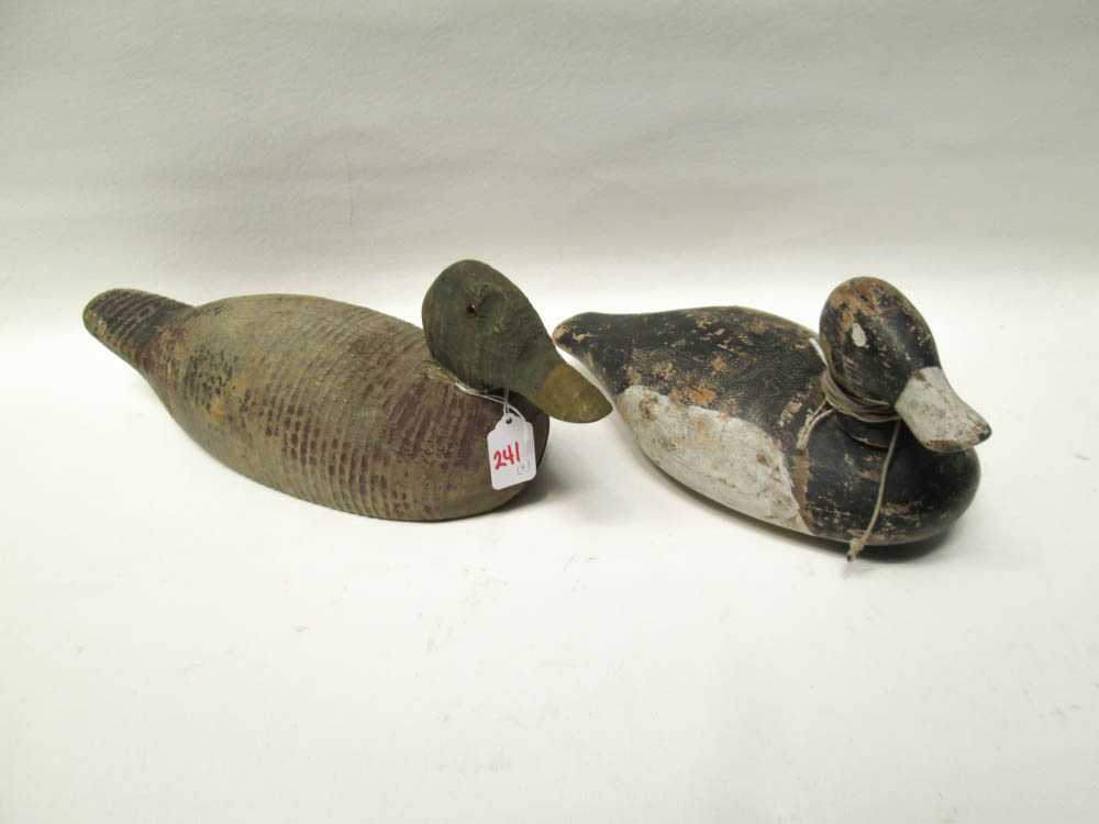 Appraisal: FOUR CARVED WOOD DUCK DECOYS three are carved from wood