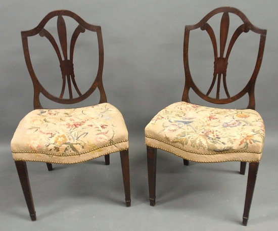 Appraisal: Pair of shield-back mahogany side chairs th c with needlepoint