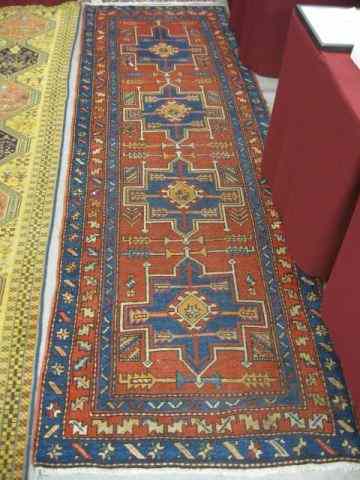 Appraisal: Heriz Persian Handmade Runner geometric designs primarily reds blues ivory