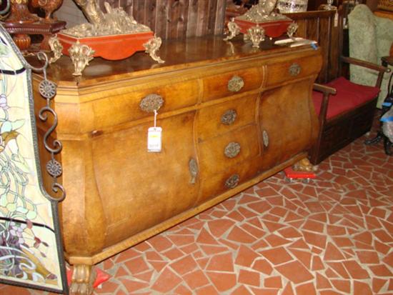 Appraisal: Continental carved walnut bombe server late th early th century