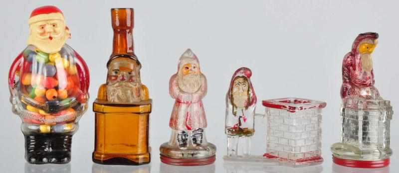 Appraisal: Lot of Glass Santa Candy Containers Description Includes one celluloid